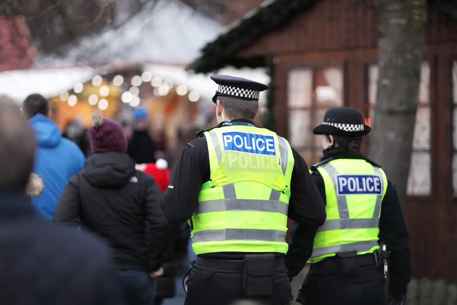 Police in hi-visibility jackets policing crowd control at a UK event
